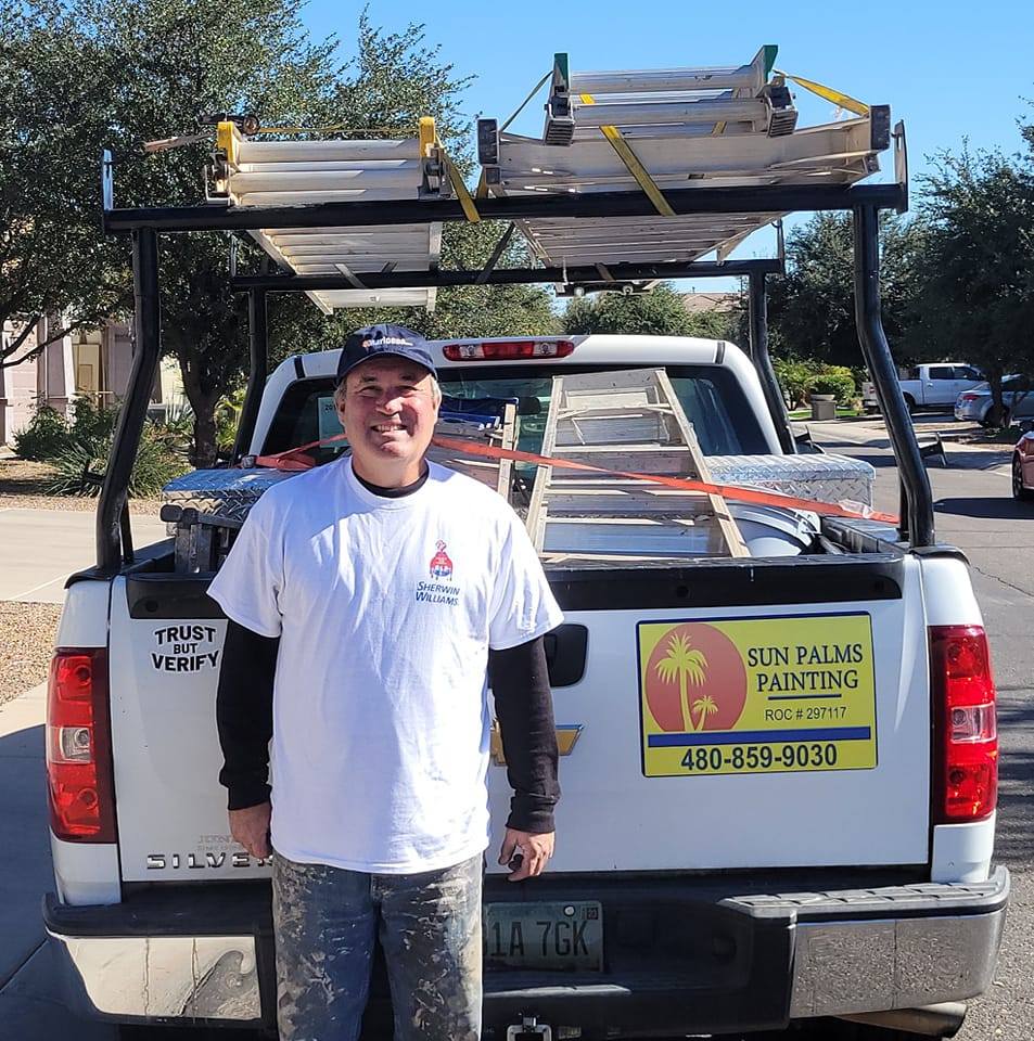 Tim Berg, owner of Sun Palms Painting, standing in front of the company truck smiling, hoping you will schedule a free house painting quote