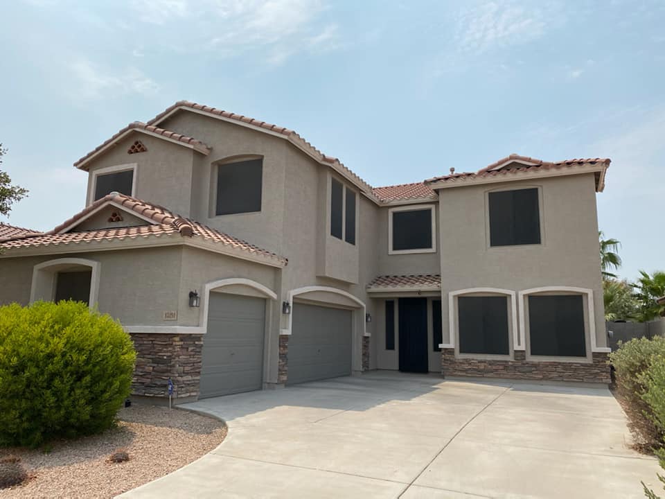 home with a modern exterior color refresh done by Sun Palms Painting, who always offers affordable house painting.