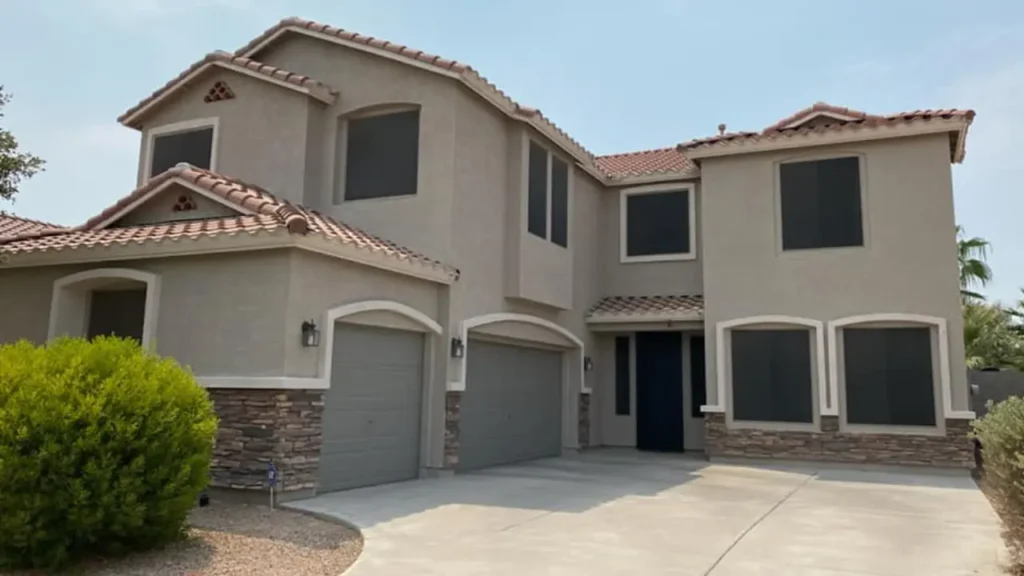 Exterior house painted beige with Sherwin-Williams paint by Sun Palms Painting in Arizona.